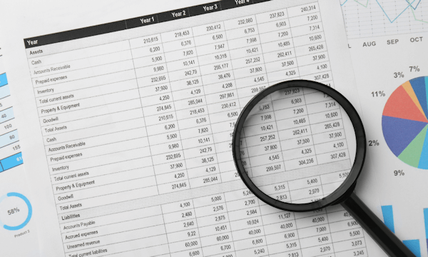  Magnifying glass over expense reports